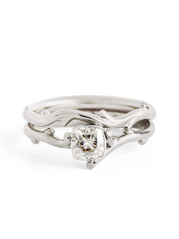 Silver ring with a diamond on a white background