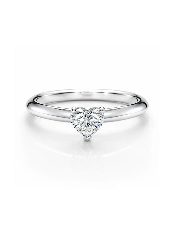 Silver ring with a heart-shaped diamond on a white background